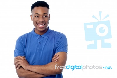 Handsome Man Posing With Folded Arms Stock Photo