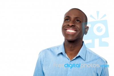 Handsome Man Smiling And Looking Away Stock Photo