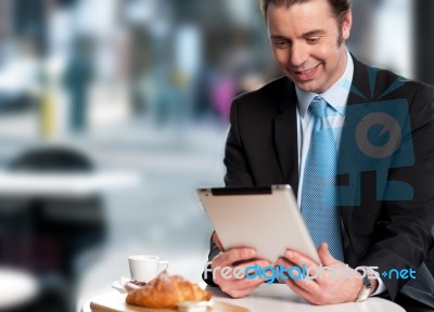 Handsome Manager Reviewing Business Updates Stock Photo