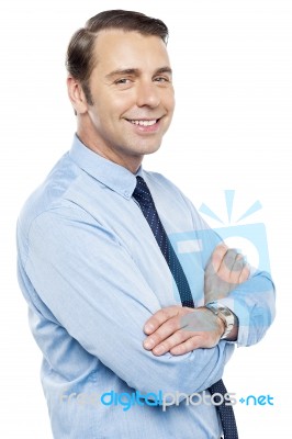 Handsome Representative Posing With Folded Arms Stock Photo