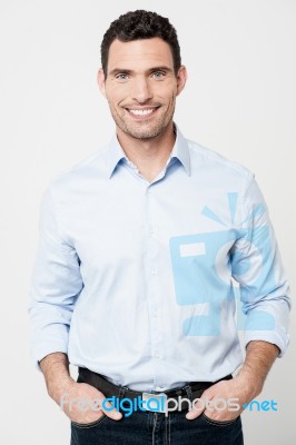 Handsome Smiling Man Posing In Casuals Stock Photo