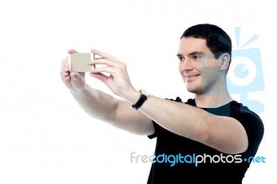 Handsome Smiling Man Taking A Selfie Stock Photo