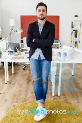 Handsome Young Businessman Looking At Camera In The Office Stock Photo