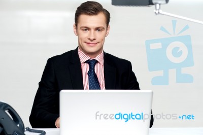 Handsome Young Businessman With Laptop Stock Photo