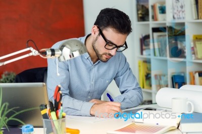 Handsome Young Businessman Working In The Office Stock Photo