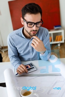 Handsome Young Businessman Working In The Office Stock Photo