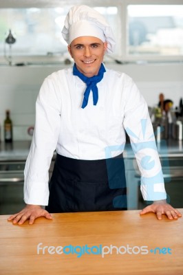 Handsome Young Chef Posing In Uniform Stock Photo