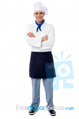 Handsome Young Chef Posing In Uniform Stock Photo