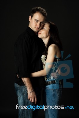 Handsome Young Couple Posing In Studio Stock Photo