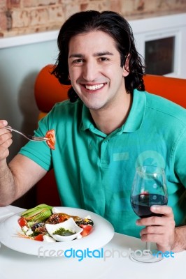 Handsome Young Guy Enjoying His Meal Stock Photo