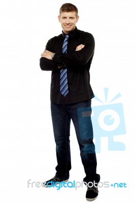 Handsome Young Male Executive With Folded Arms Stock Photo