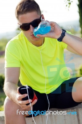 Handsome Young Man Drinking After Running Stock Photo