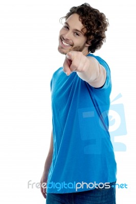 Handsome Young Man Pointing Towards Camera Stock Photo