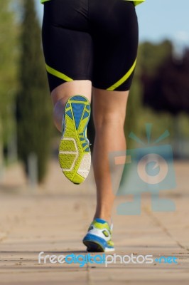 Handsome Young Man Running In The Park Stock Photo