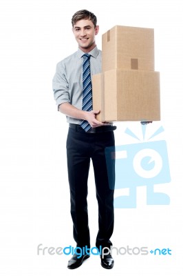 Handsome Young Man With With Stack Of Boxes Stock Photo