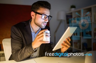 Handsome Young Man Working With Digital Tablet In The Office Stock Photo