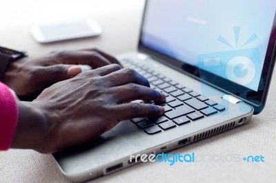 Handsome Young Man Working With His Laptop At Home Stock Photo