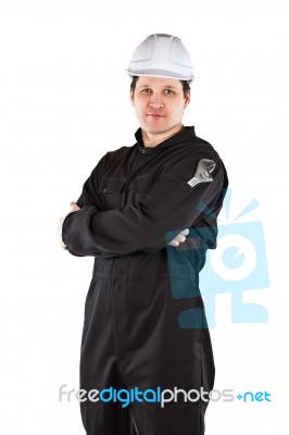 Handyman Wearing Uniform And Hardhat Stock Photo