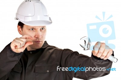 Handyman Wearing Uniform And Hardhat Stock Photo