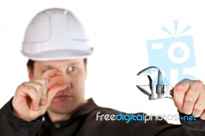 Handyman Wearing Uniform And Hardhat Stock Photo