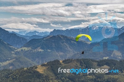 Hang-gliding Above The Countryside Around Zwölferhorn Mountain Stock Photo