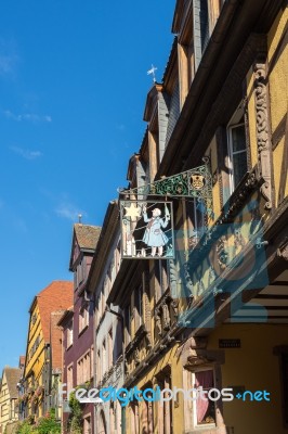 Hanging Sign In Riquewihr In Haut-rhin Alsace France Stock Photo