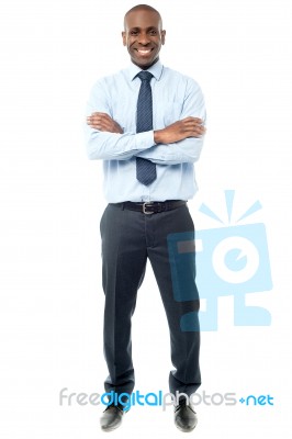 Happy African Businessman Arms Folded Stock Photo