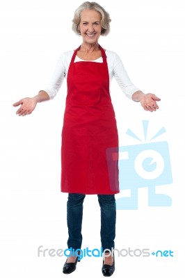 Happy Aged Chef Gesturing Welcome Stock Photo