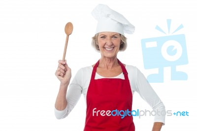 Happy Aged Chef Holding Wooden Spoon Stock Photo