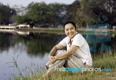 Happy Asian Woman In Public Park Stock Photo