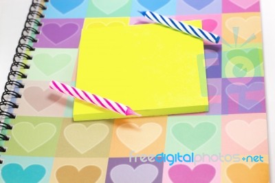 Happy Birthday Candle And Blank Notepad With Love Diary Stock Photo