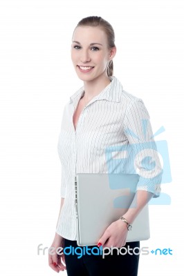 Happy Business Executive Holding Laptop Stock Photo