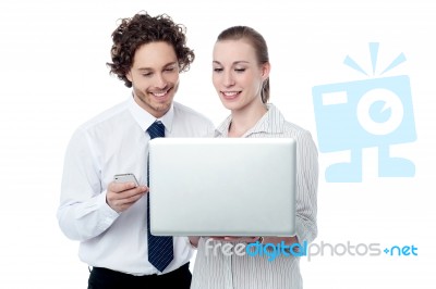 Happy Business People  Browsing On A Laptop Stock Photo