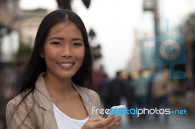 Happy Business Women Using Smart Phone Stock Photo