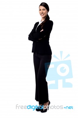 Happy Businesswoman With Folded Arms Stock Photo