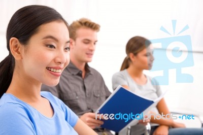 Happy Businesswoman With Her Colleagues In Office Stock Photo