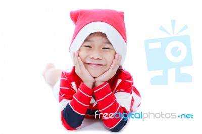 Happy Christmas Boy Laying And Smiling Stock Photo