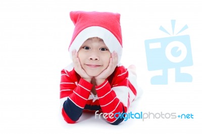 Happy Christmas Boy Laying And Smiling Stock Photo