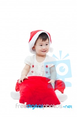 Happy Christmas Girl Sitting And Smiling Stock Photo