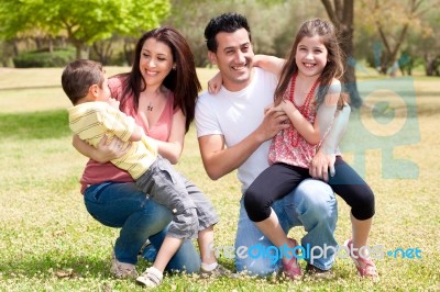 Happy Family Enjoying In The Park Stock Photo