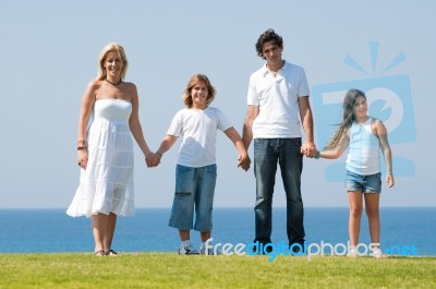 Happy family holding hands Stock Photo