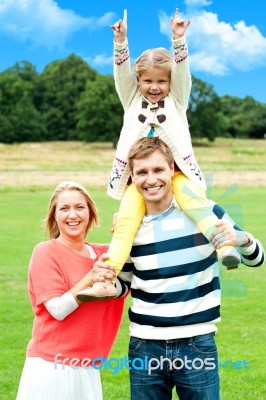 Happy Family In Park Stock Photo