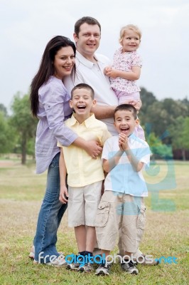 Happy Family In The Park Stock Photo