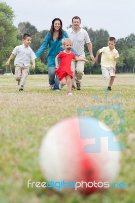 Happy Family Of Five Having Outdoors Stock Photo