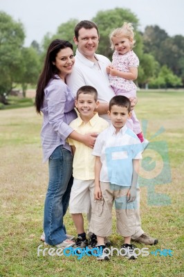 Happy Family Of Five Posing On Natural Background Stock Photo