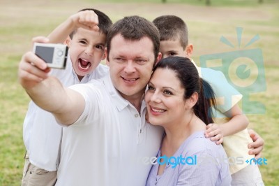 Happy Family Pilled Together And Taking Self Portrait Stock Photo