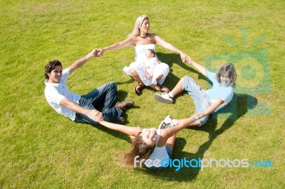 Happy Family Playing In Garden Stock Photo