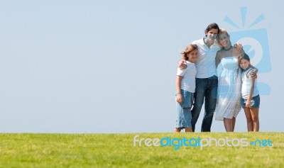 Happy family relaxing in garden Stock Photo