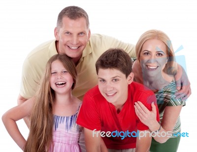 Happy Family Smiling Towards The Camera Stock Photo