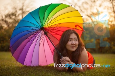 Happy Fatty Woman With Umbrella Stock Photo